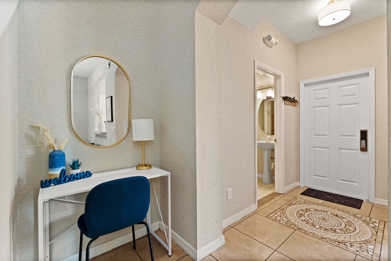 A desk workspace off the entryway is ideal for catching up on emails