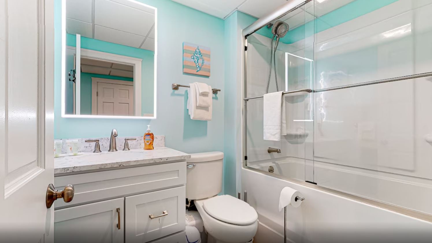 A single vanity & shower/tub combo await in this ensuite bath