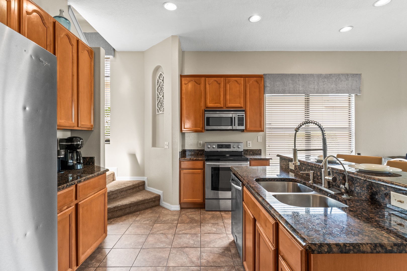The open, airy kitchen offers ample space & every home comfort