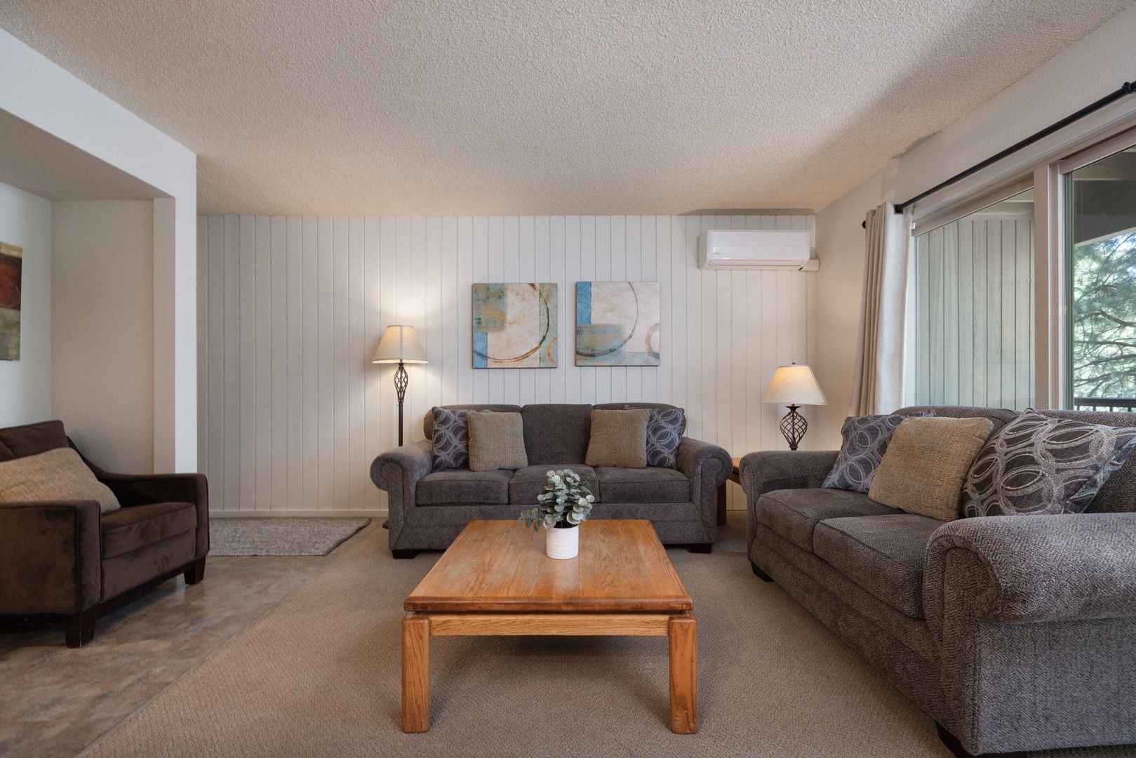 Living area with comfy seating and Smart TV