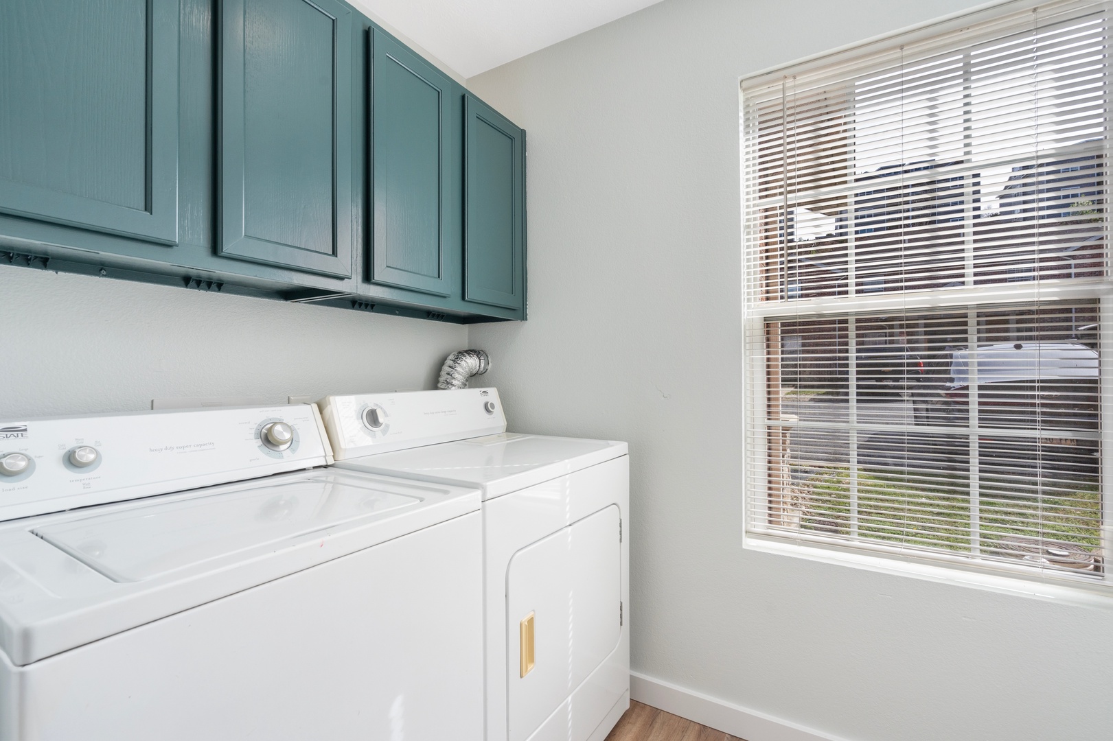 Private laundry is available for your stay, tucked away off the kitchen