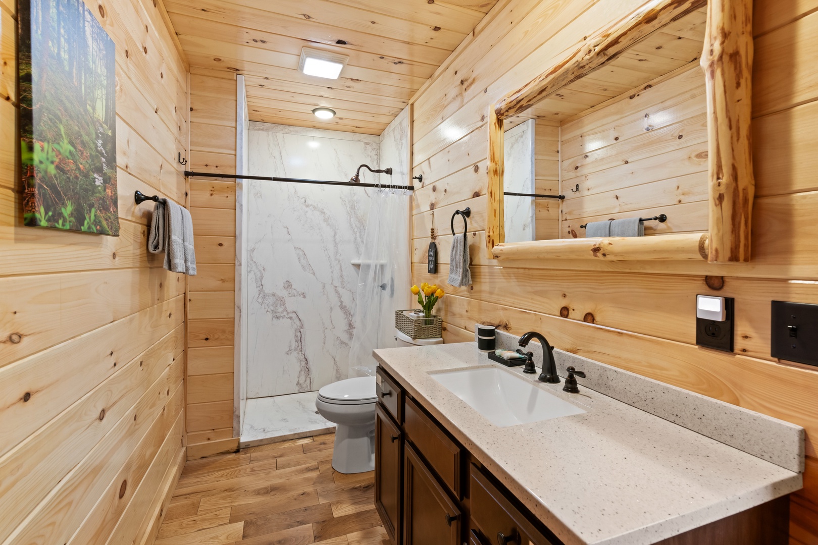 This ensuite bath features a large single vanity & walk-in shower