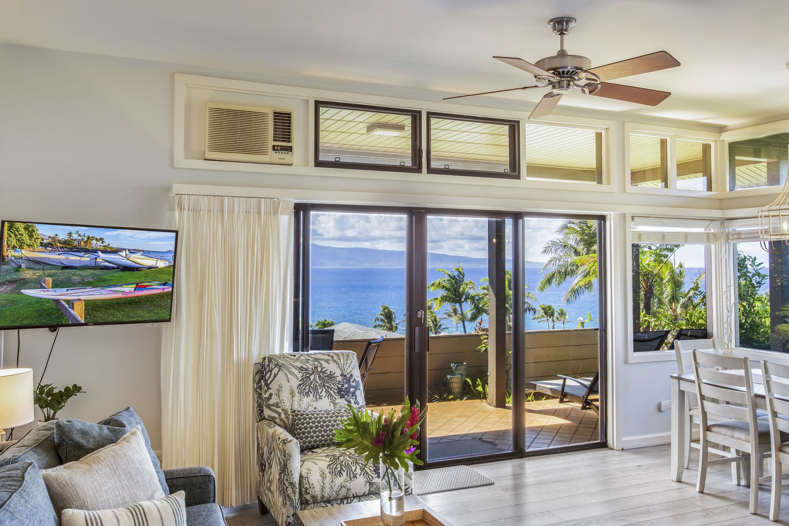 Floor-to-ceiling sliding glass doors in the living area