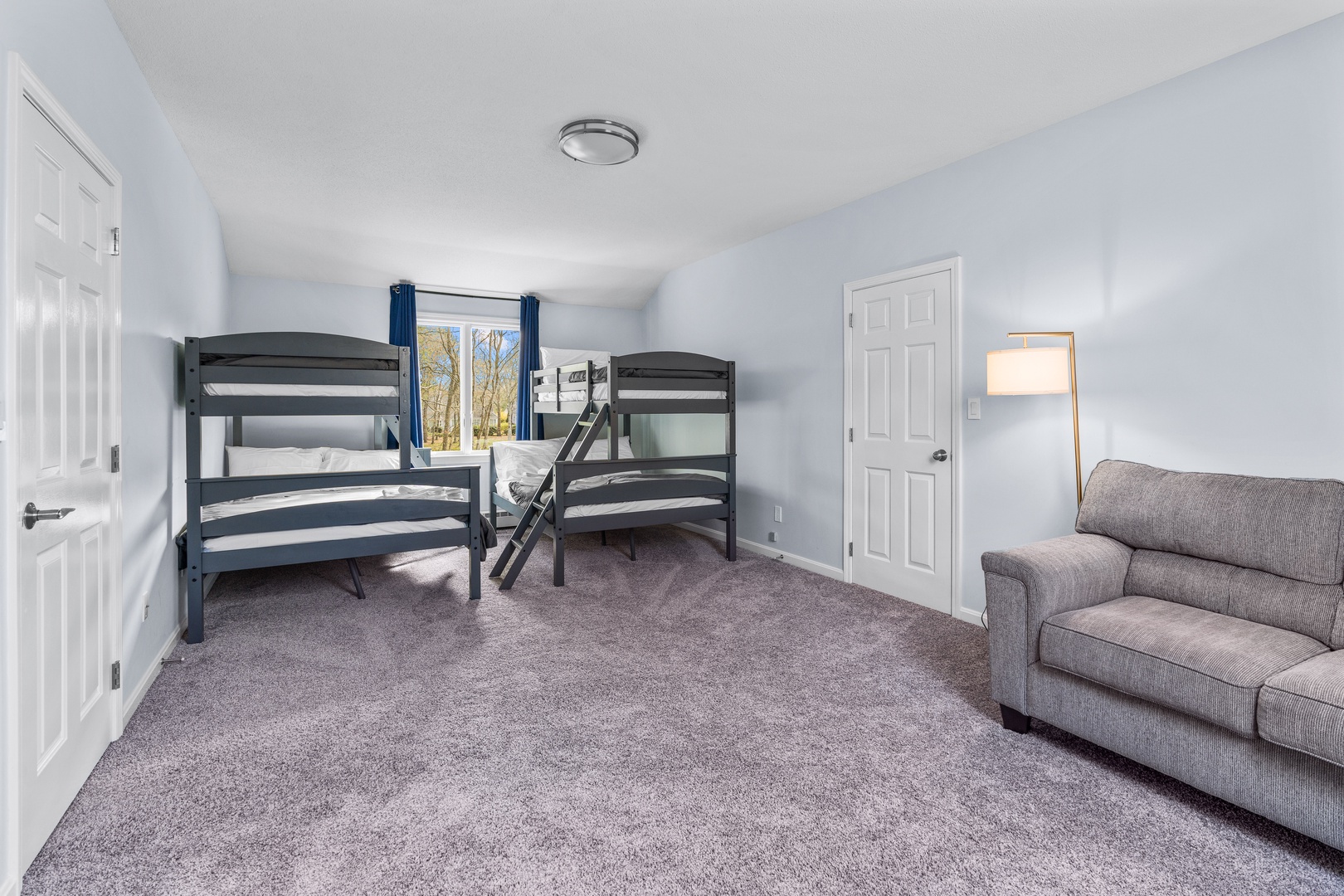 The final 2nd floor bedroom offers a kids’ area & a pair of twin-over-full bunkbeds