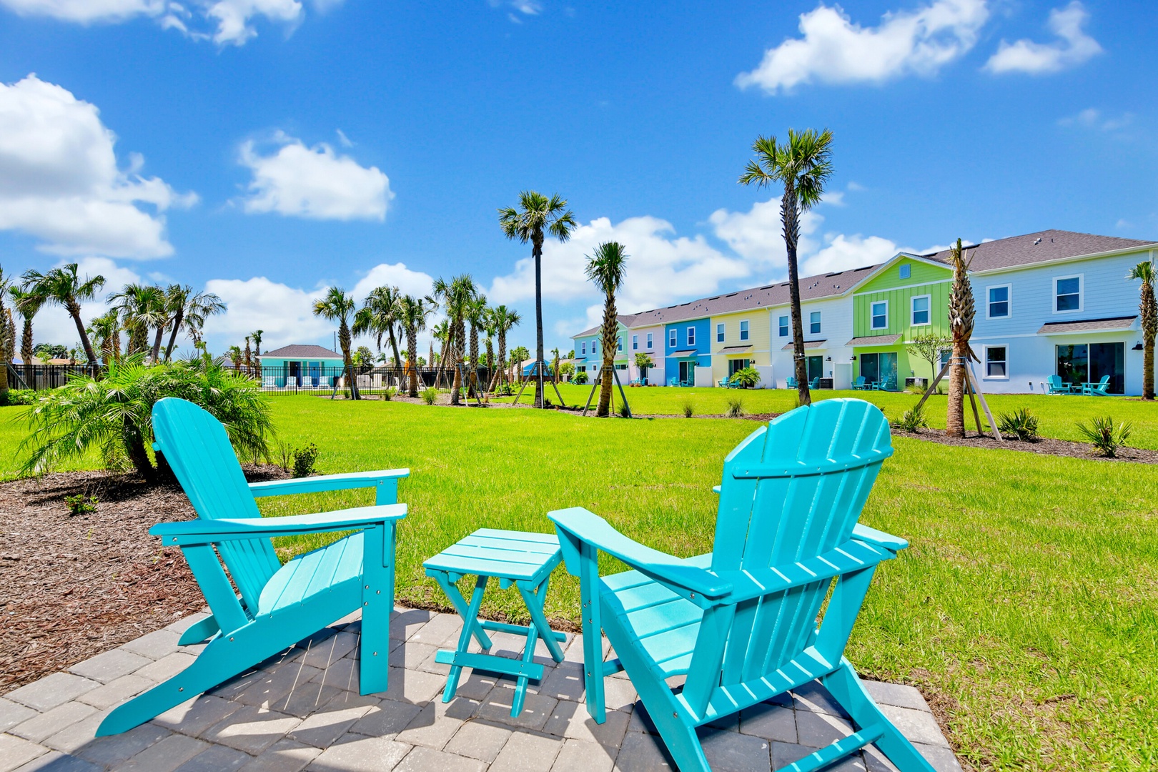 Adirondack chairs, swaying palms, and endless views