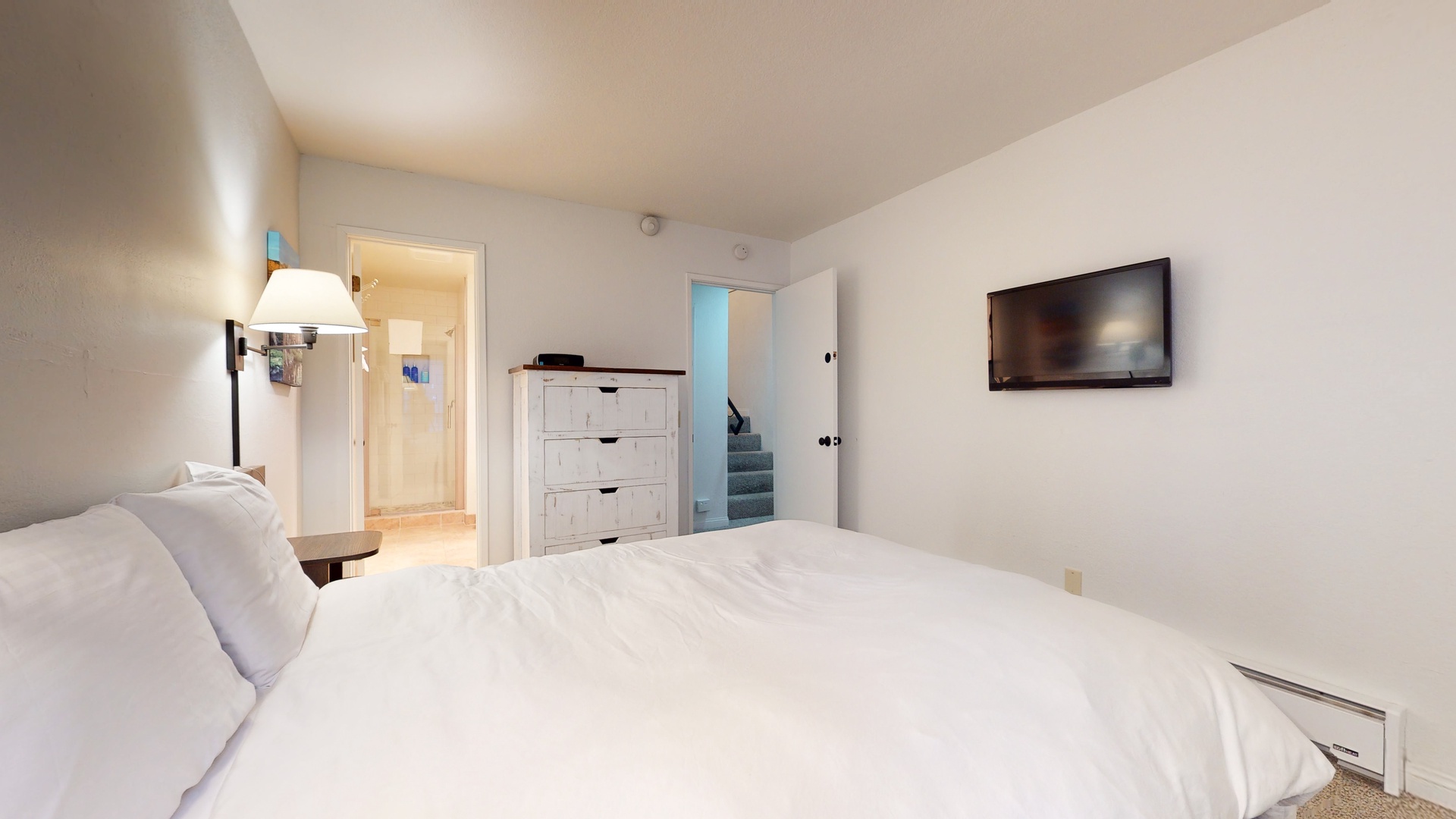 2nd bedroom: Queen bed with TV and en suite bathroom