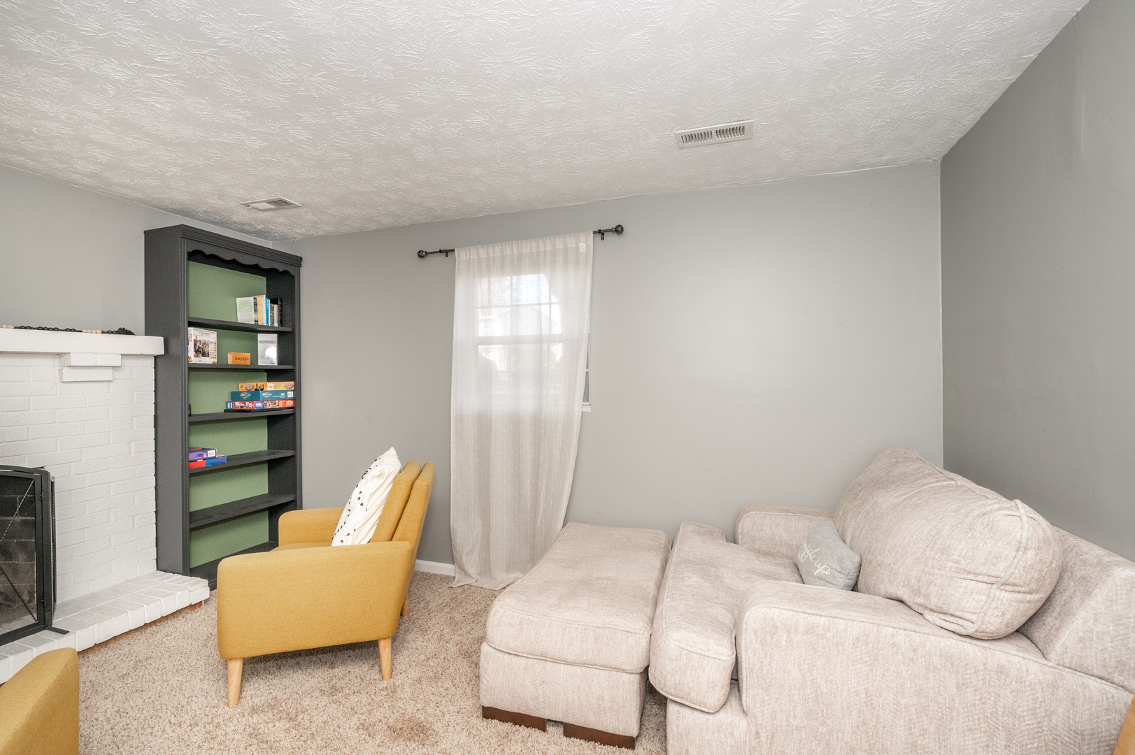 Escape to the lower-level den & kick back with a book