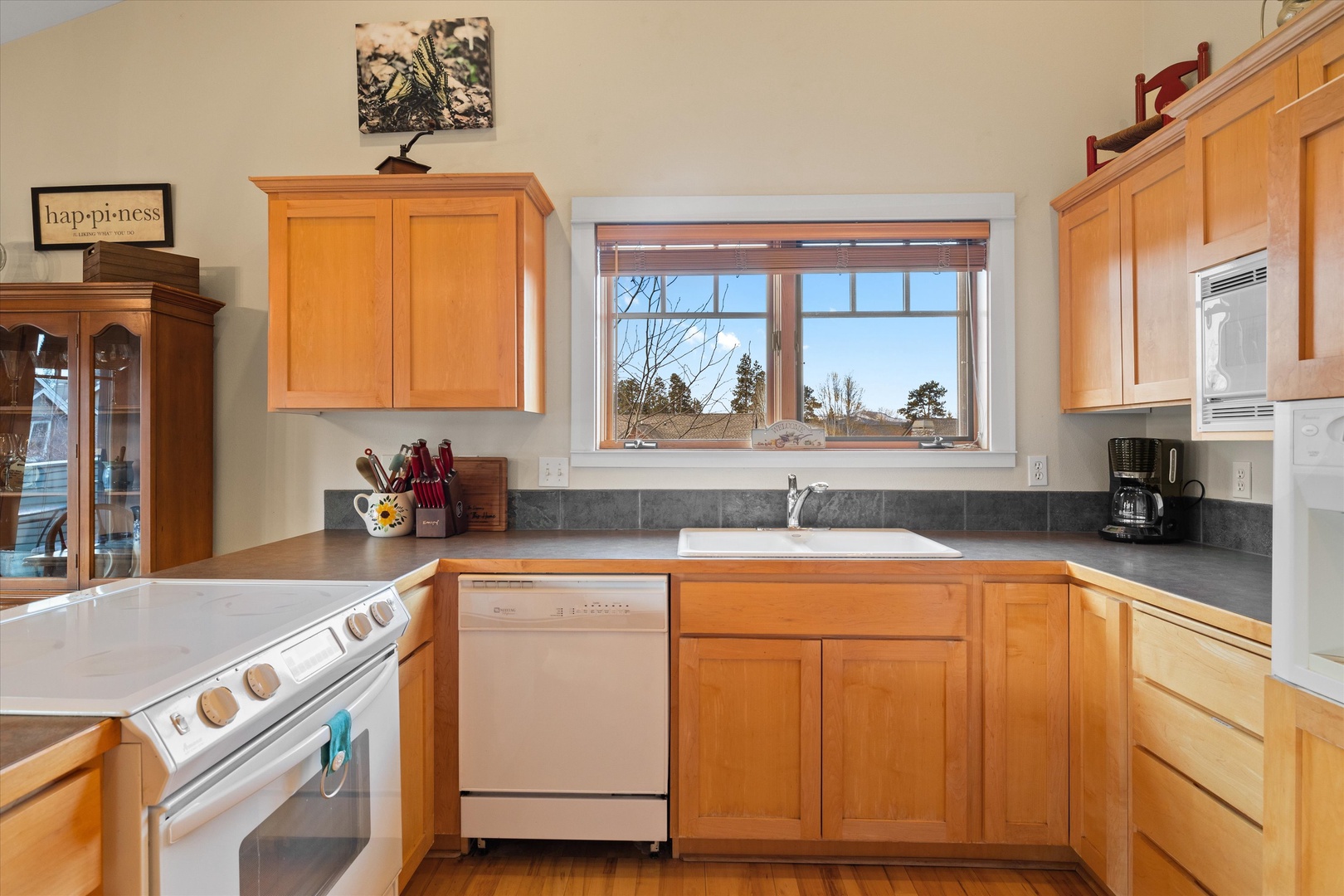 The open kitchen offers ample space & all the comforts of home