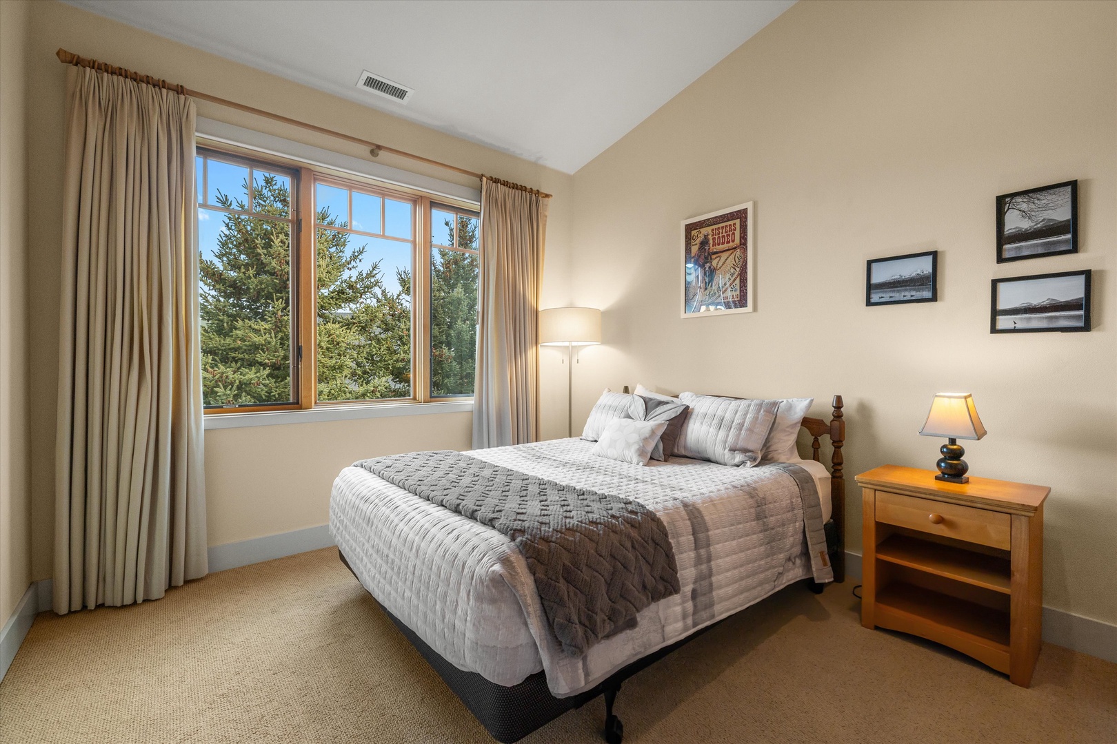 A plush queen-sized bed awaits in the second bedroom retreat