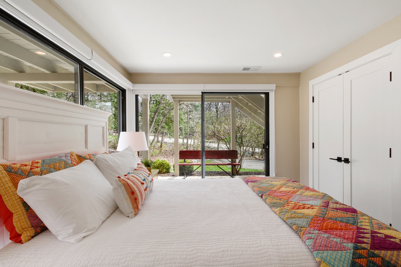 The second bedroom retreat includes a queen bed & deck access