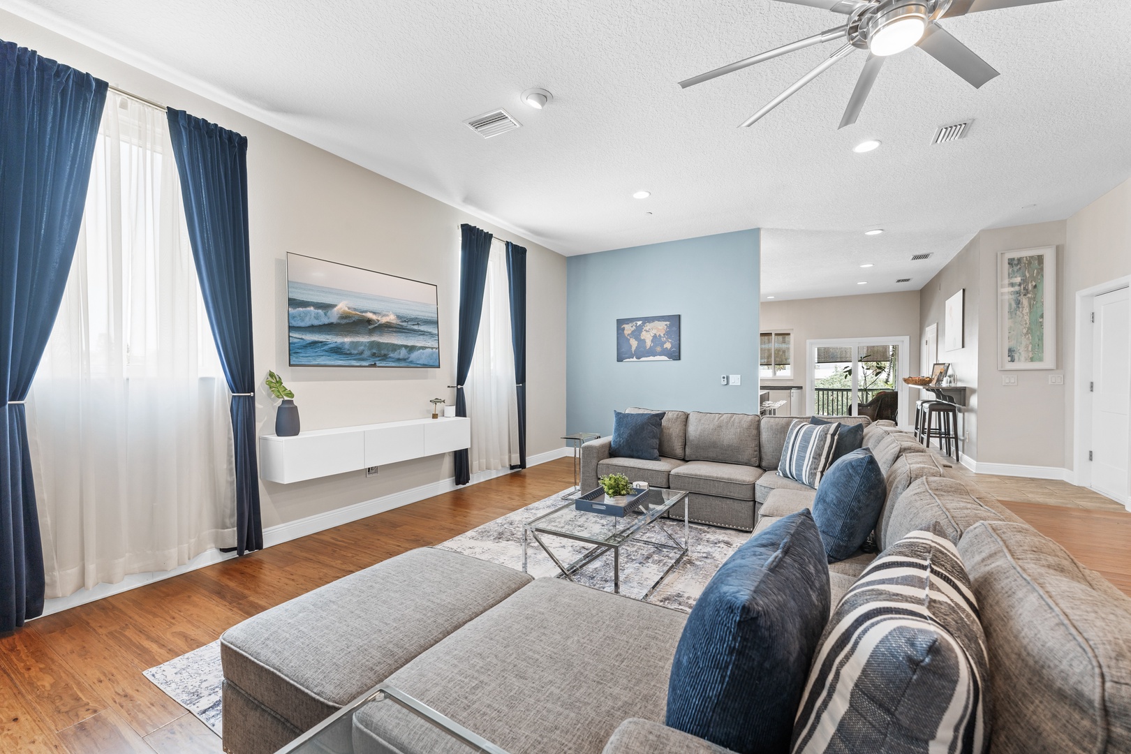 Living area with large sectional and Smart TV