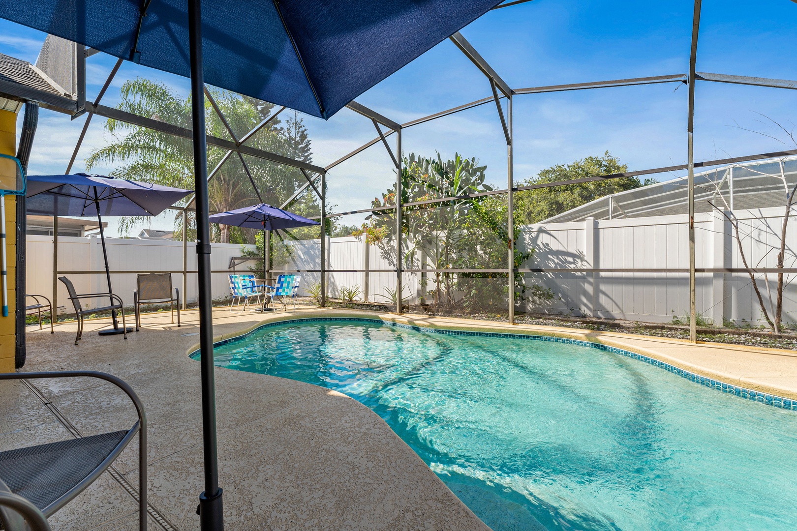 Screened in pool with outdoor seating