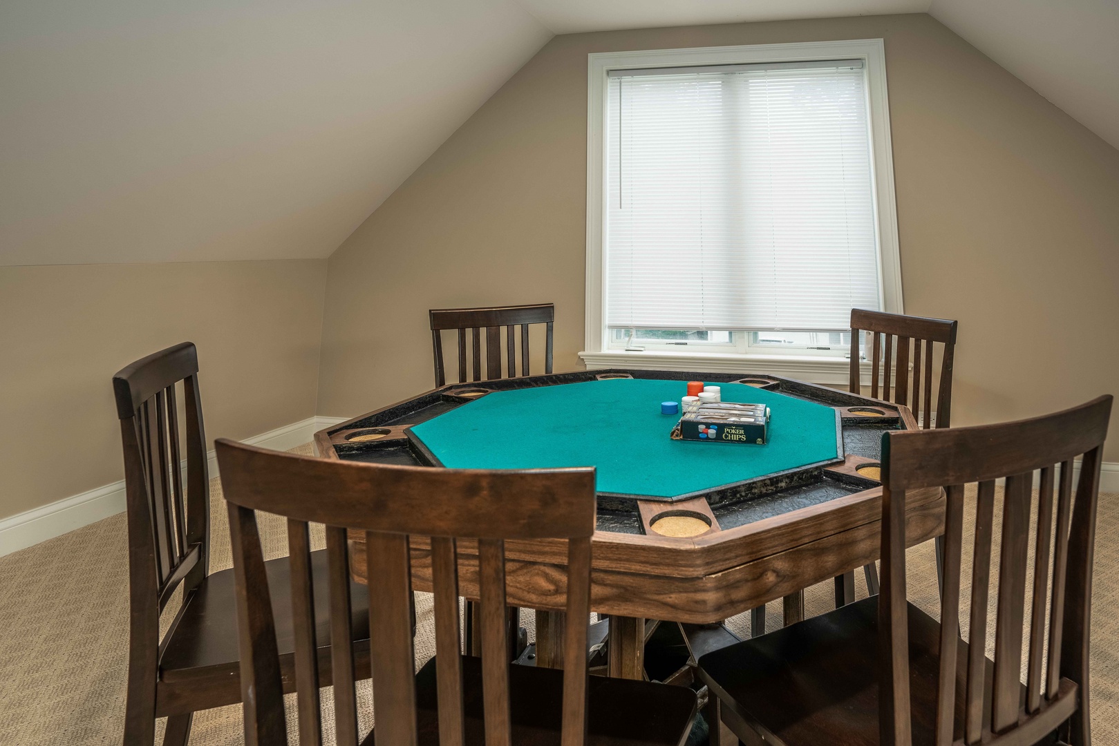 Game room with sitting area, Smart TV, wet bar, pool table, and poker table