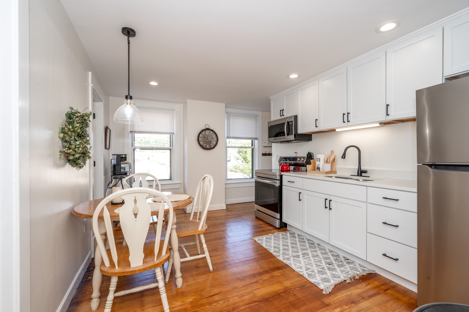 Step into Apartment B’s sunny kitchen, boasting plenty of space & amenities