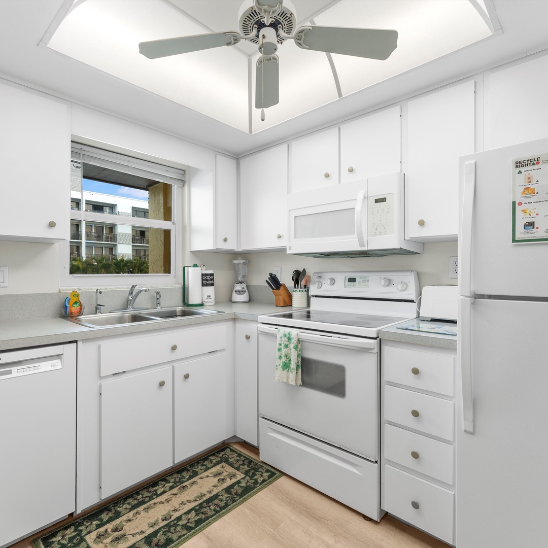 The sunny kitchen offers ample space & all the comforts of home