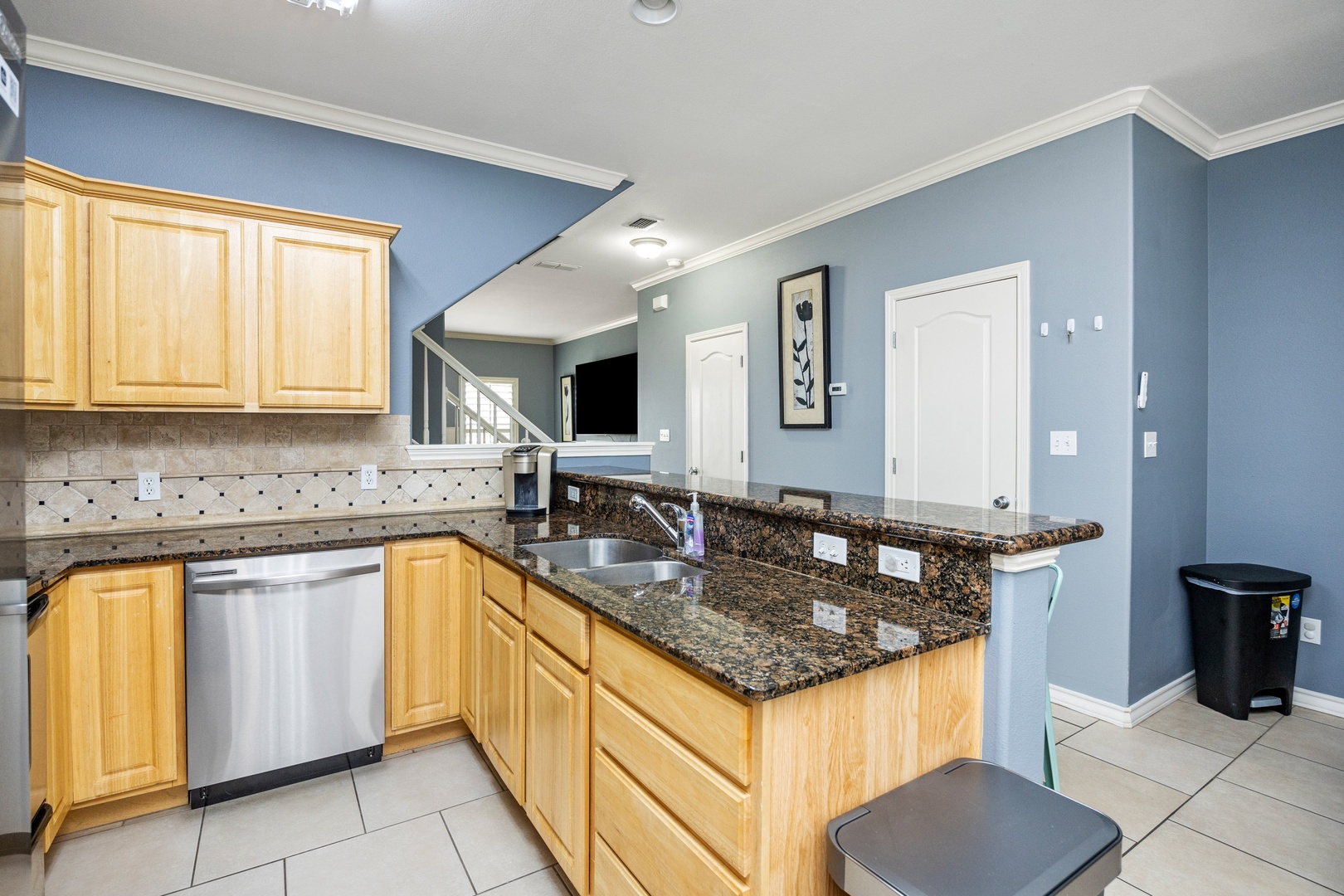 The open, airy kitchen offers ample space & all the comforts of home