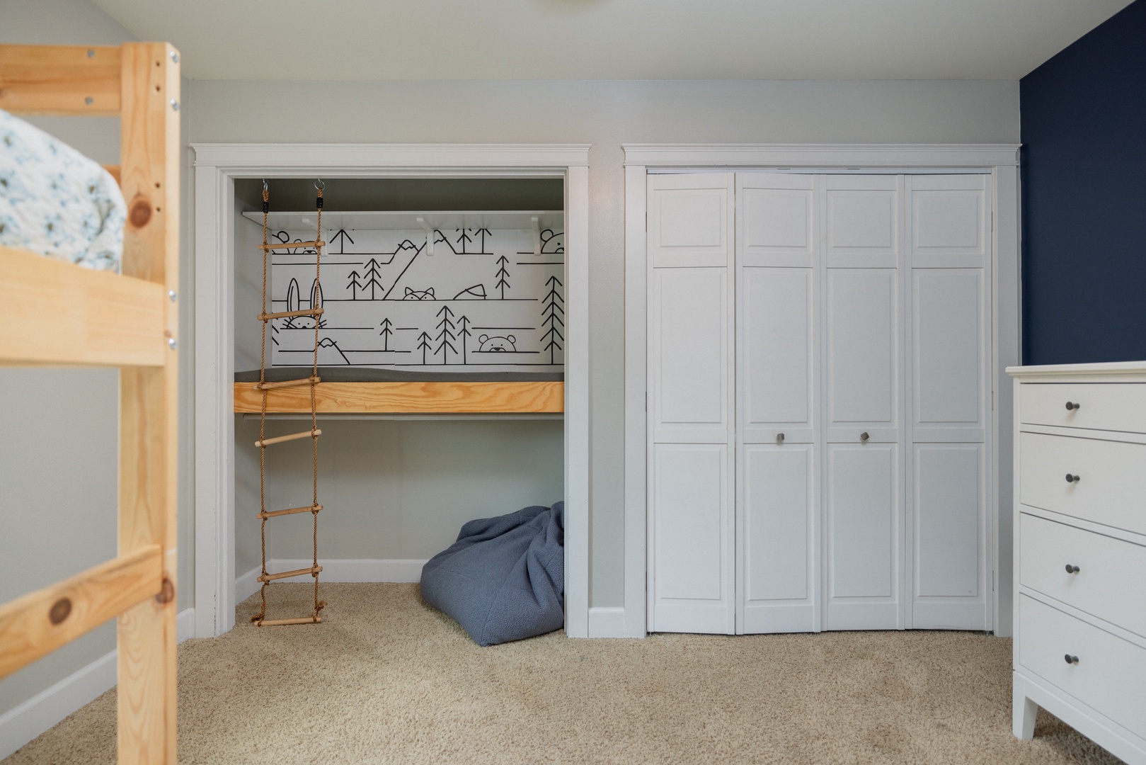 This 2nd floor bedroom boasts a cozy reading nook & twin-over-twin bunks