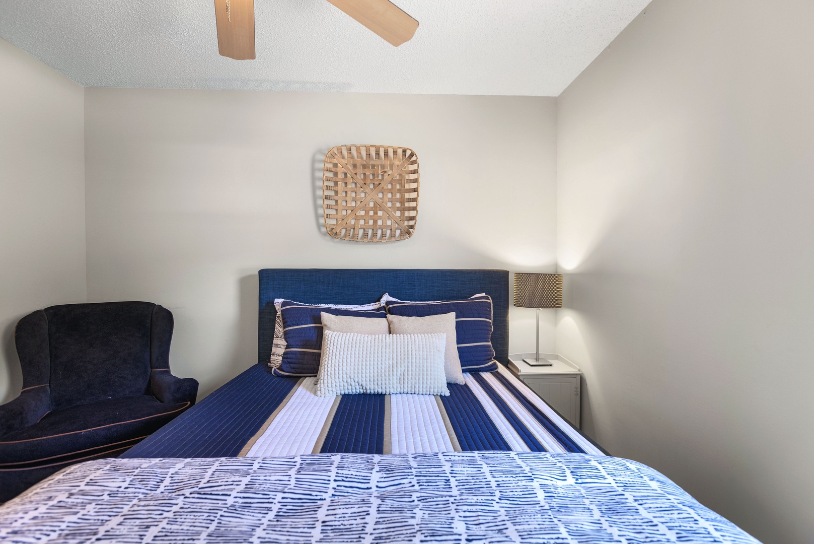 The second bedroom on the main floor offers a regal queen bed & Smart TV