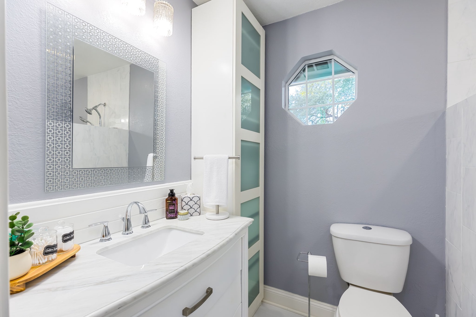 Private dual vanity areas & a glass walk-in shower await in this Jack & Jill bath