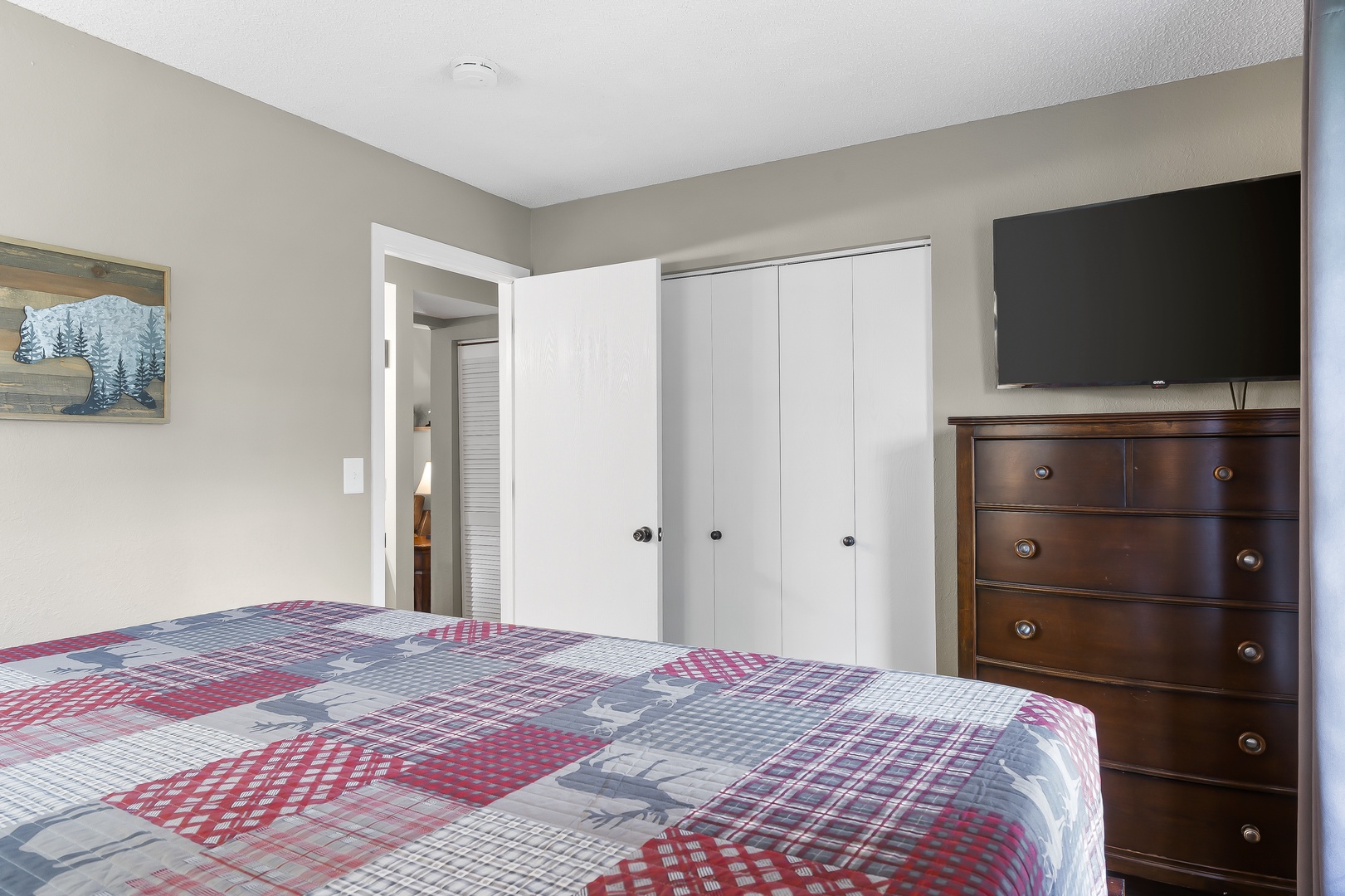 The bedroom retreat offers a plush king bed, ensuite bath, & Smart TV