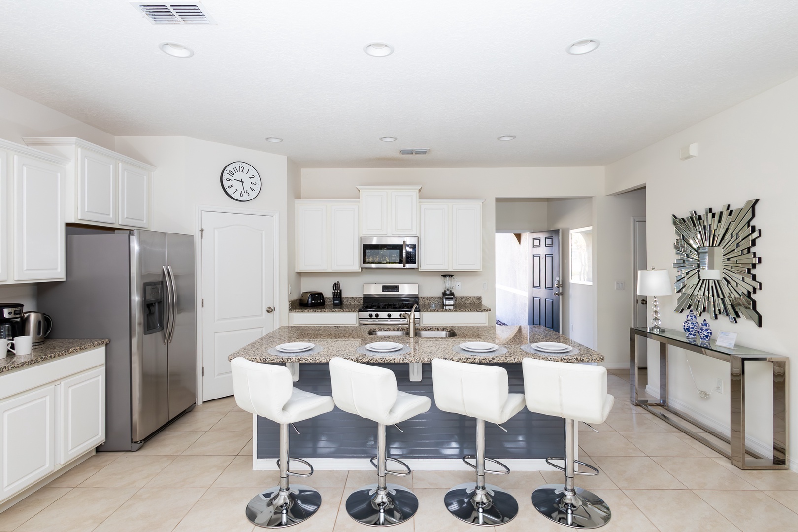 Sip morning coffee or grab a bite at the kitchen counter, with space for 4