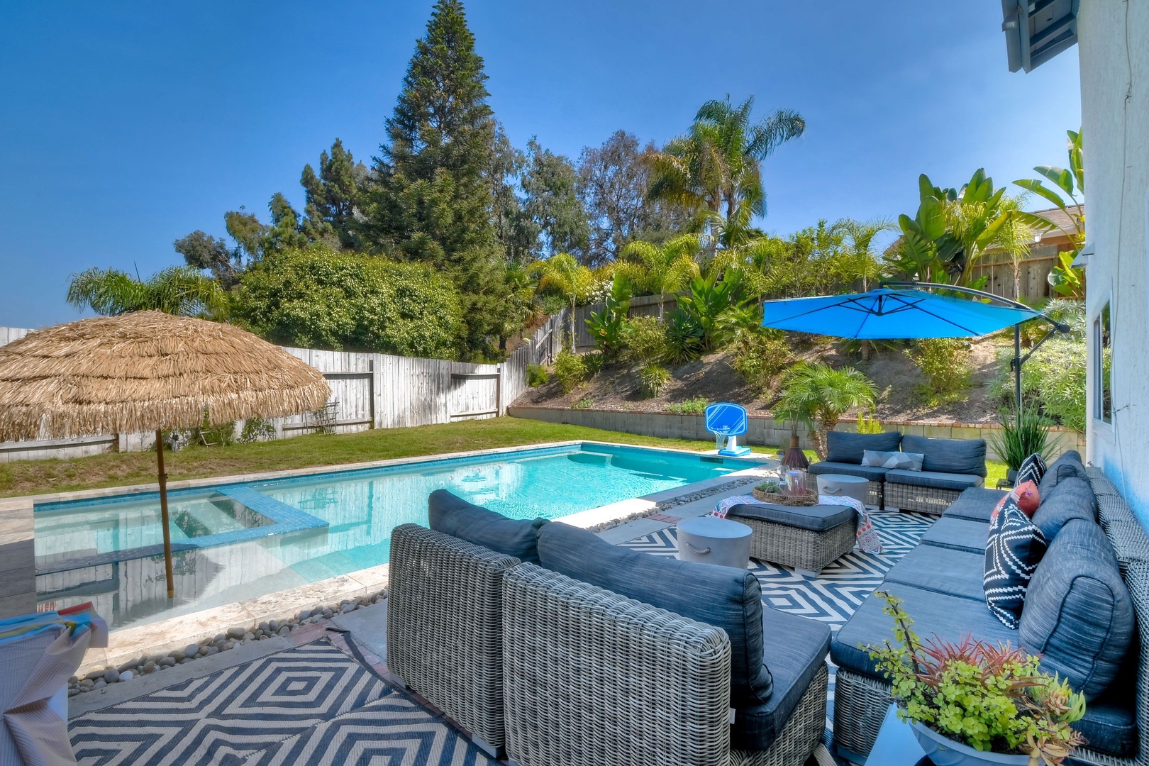 Backyard with ample seating and private pool