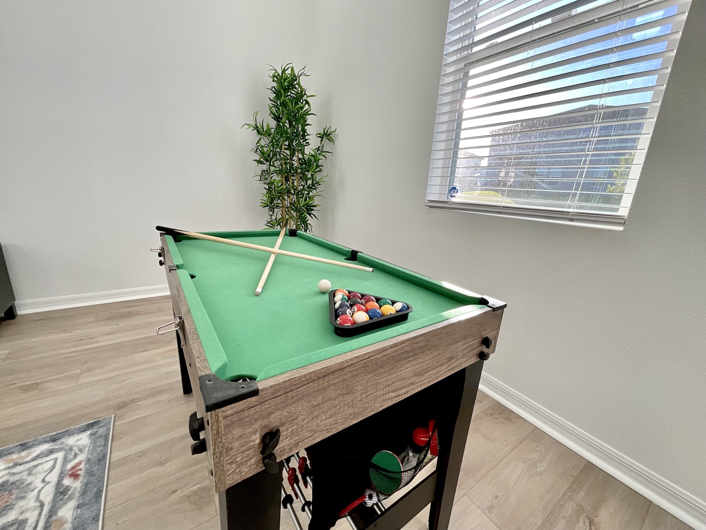 Get competitive with a round of pool or foosball in the living room!