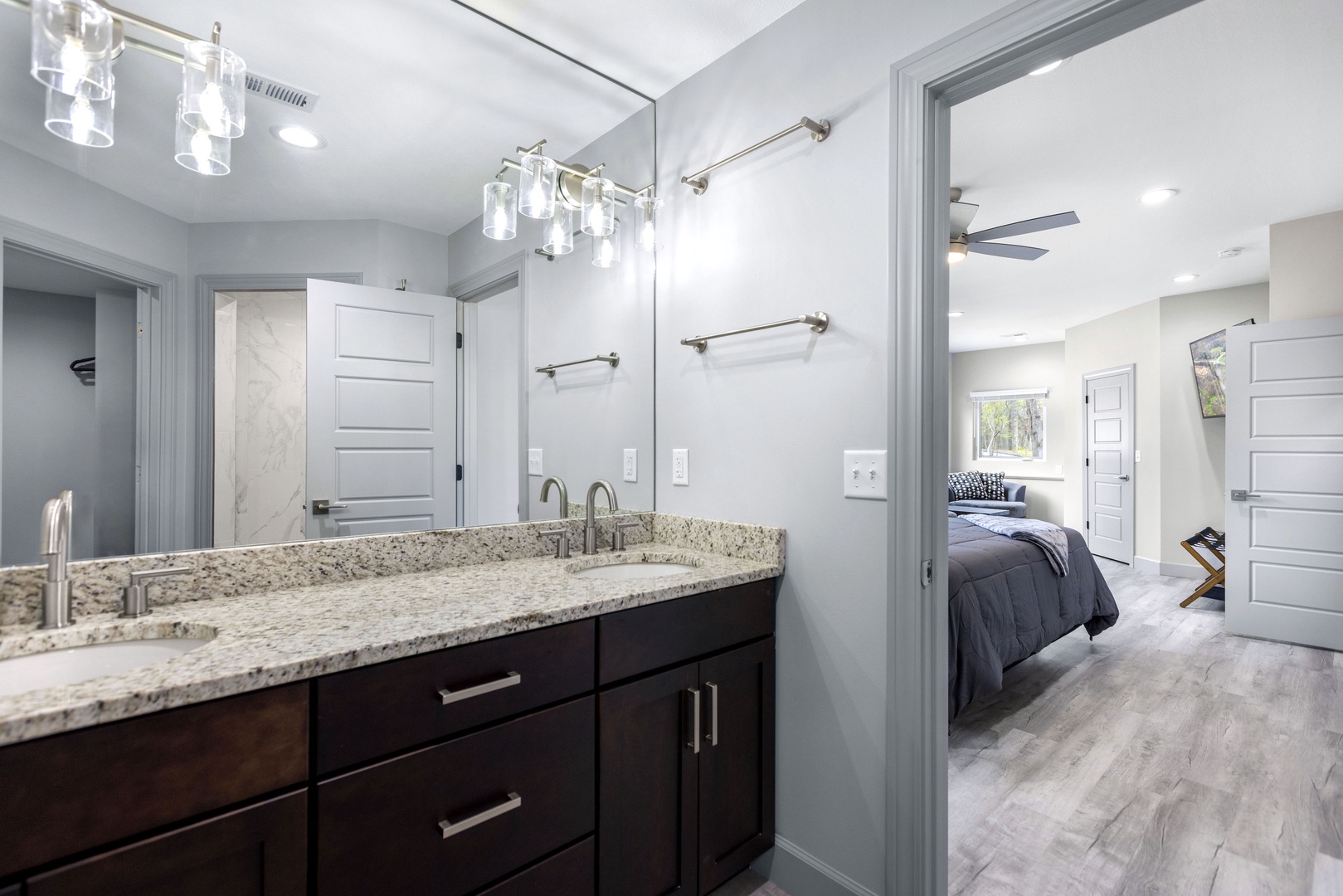 The private king ensuite offers a double vanity sink & walk-in shower