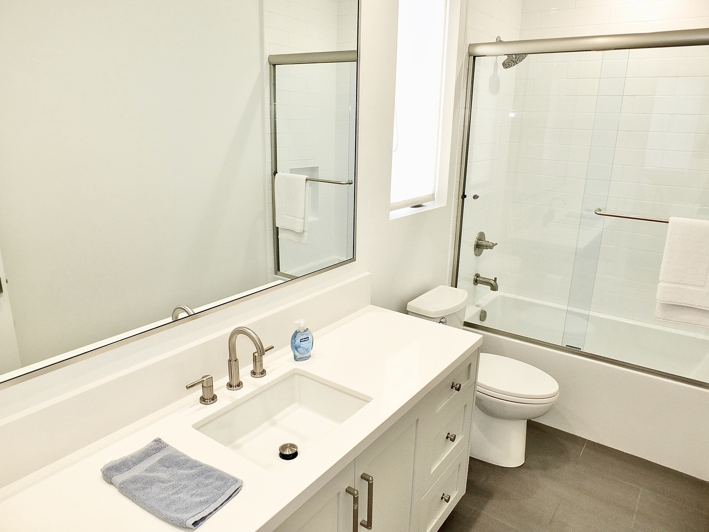 Enjoy a large vanity & shower/tub combo in this ensuite bathroom