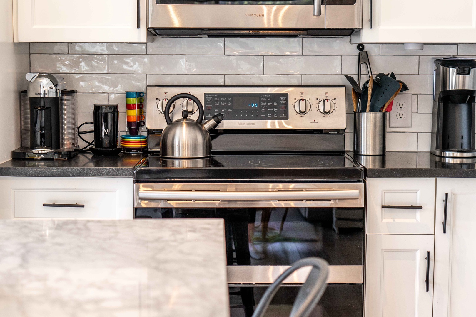 The open, airy kitchen offers ample space & all the comforts of home