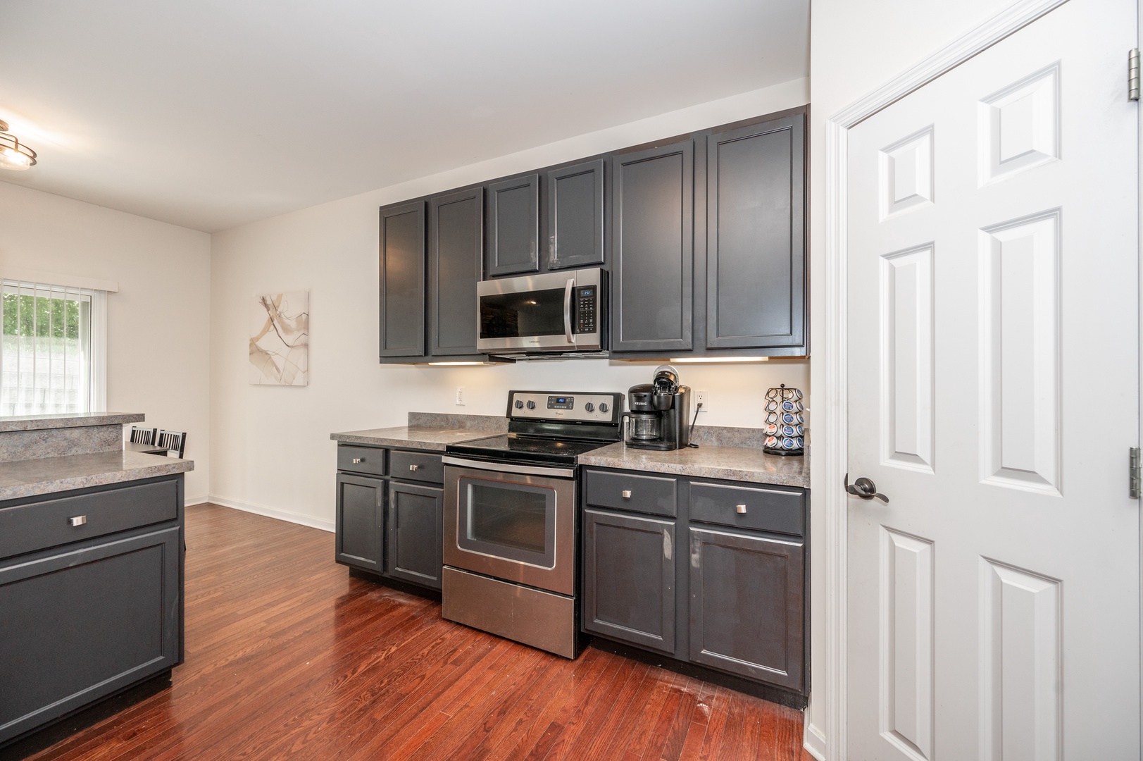 The open kitchen is spacious & fully-equipped with great amenities
