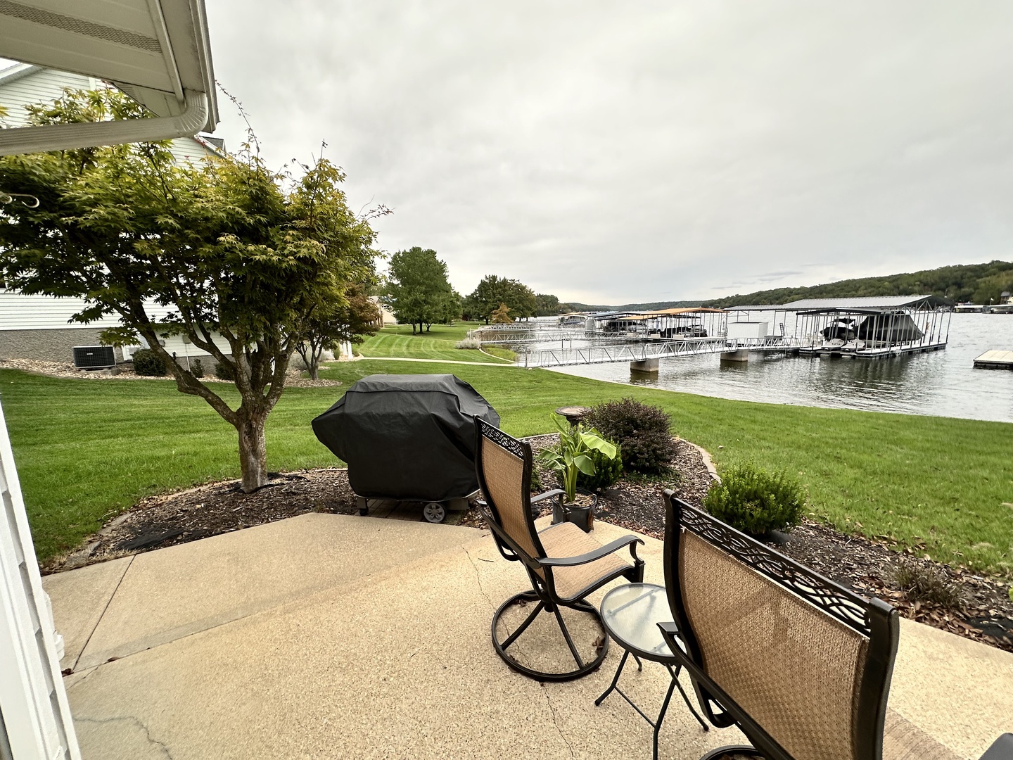 Patio with outdoor seating grill, and lake view