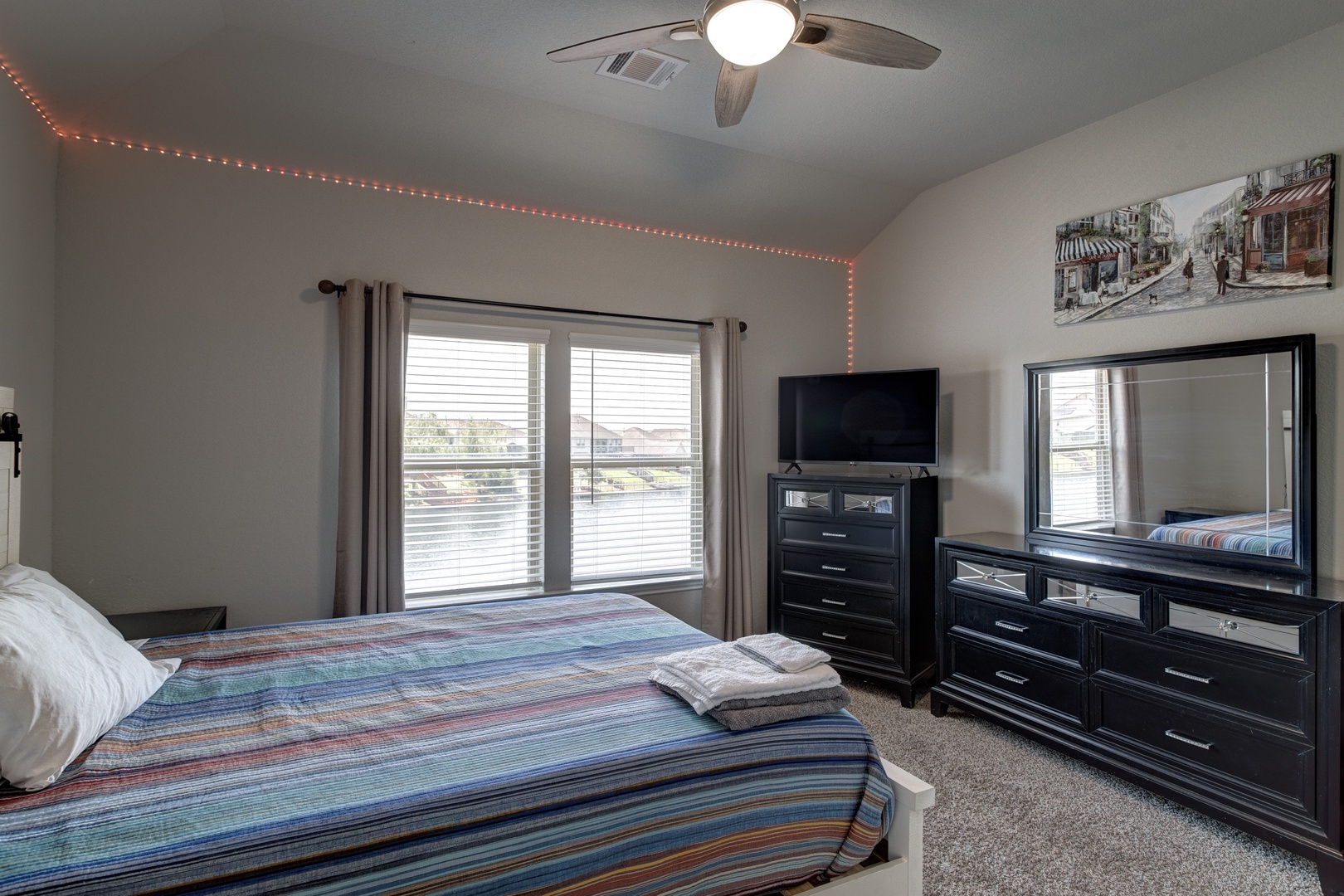 Bedroom 2 with queen bed, Lake view, Smart TV, and ensuite