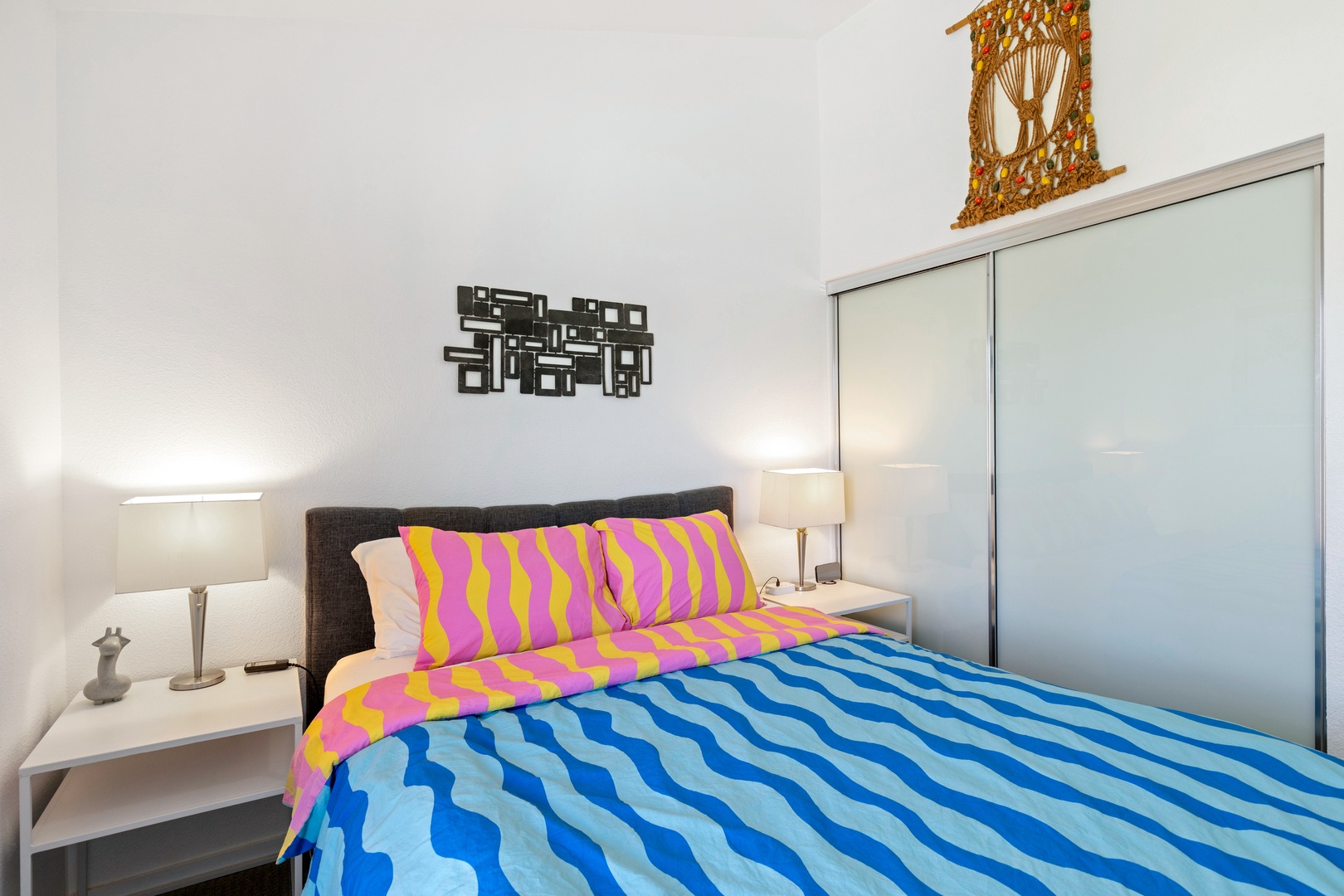 The second bedroom offers a TV & an adjustable queen bed for personalized comfort