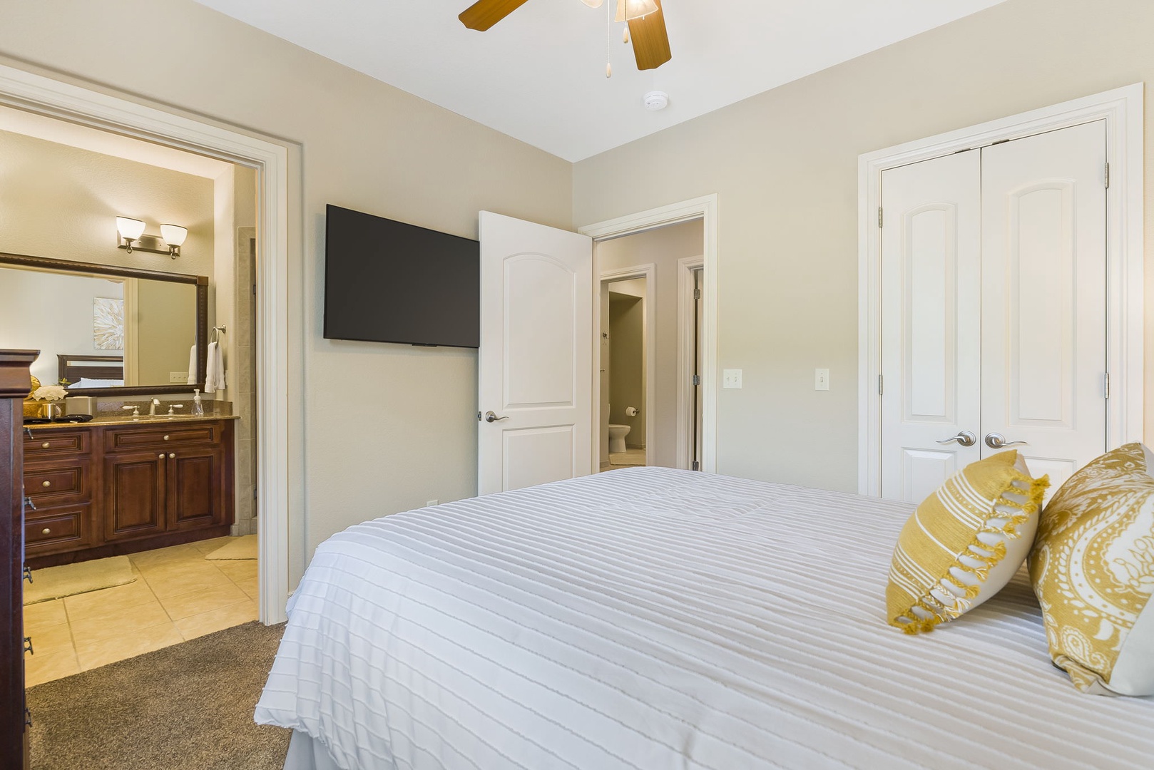 Bedroom 3 with Queen bed, TV, and en-suite