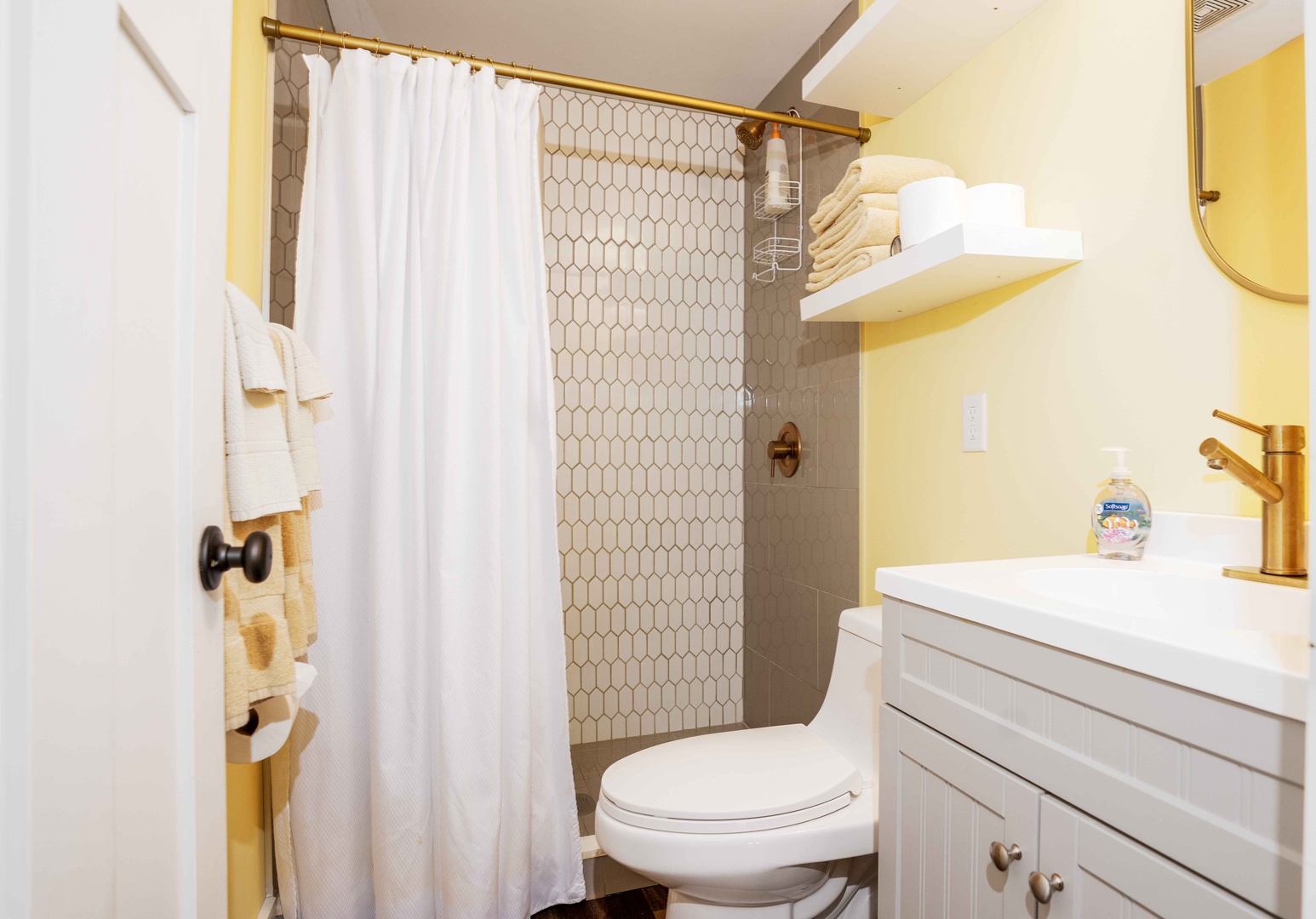 This 2nd floor full bath showcases a single vanity & posh walk-in shower