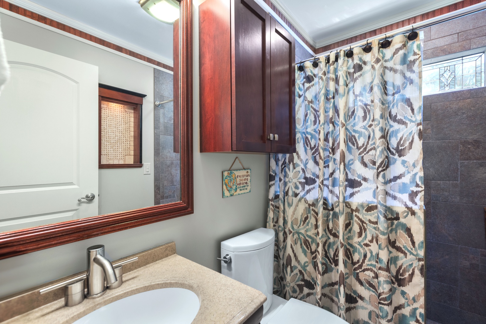 Start the day in this 1st floor full bath, with a walk-in shower