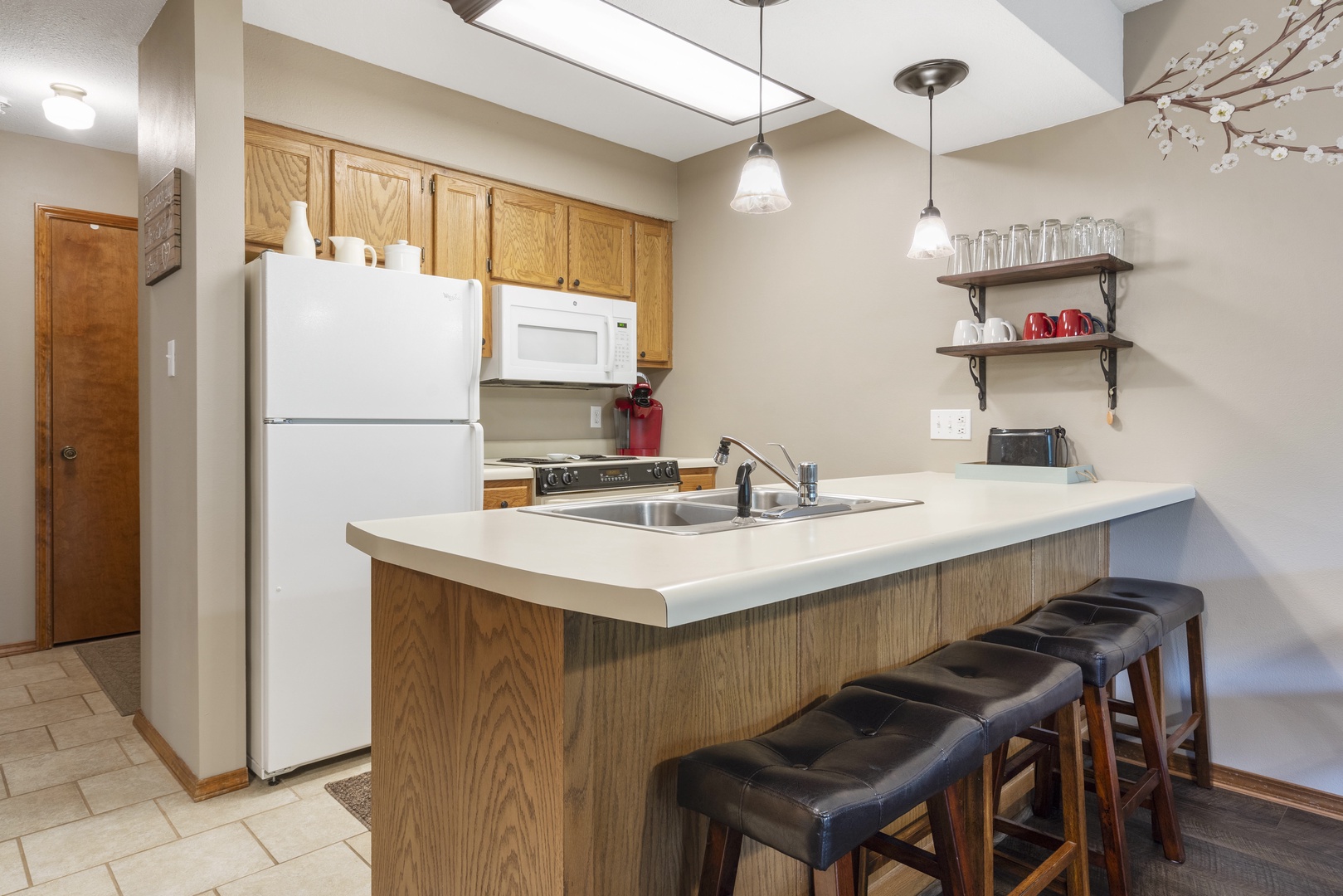 The open, airy kitchen offers ample space & all the comforts of home