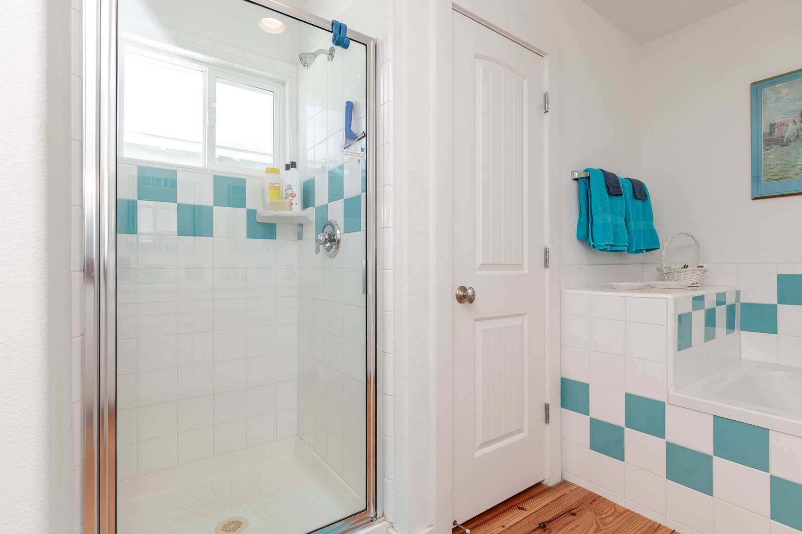 The king en suite boasts an oversized vanity, soaking tub, & glass shower