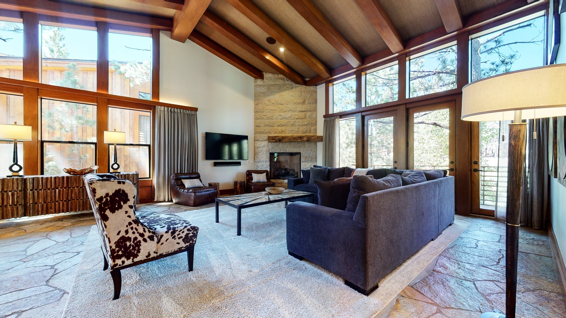 Open living area with Smart TV, fireplace, and balcony access (2nd floor)