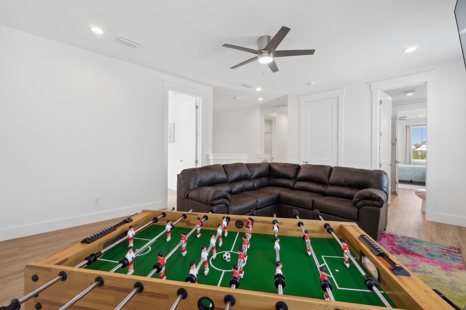 Second floor living space with Smart TV, and foosball table