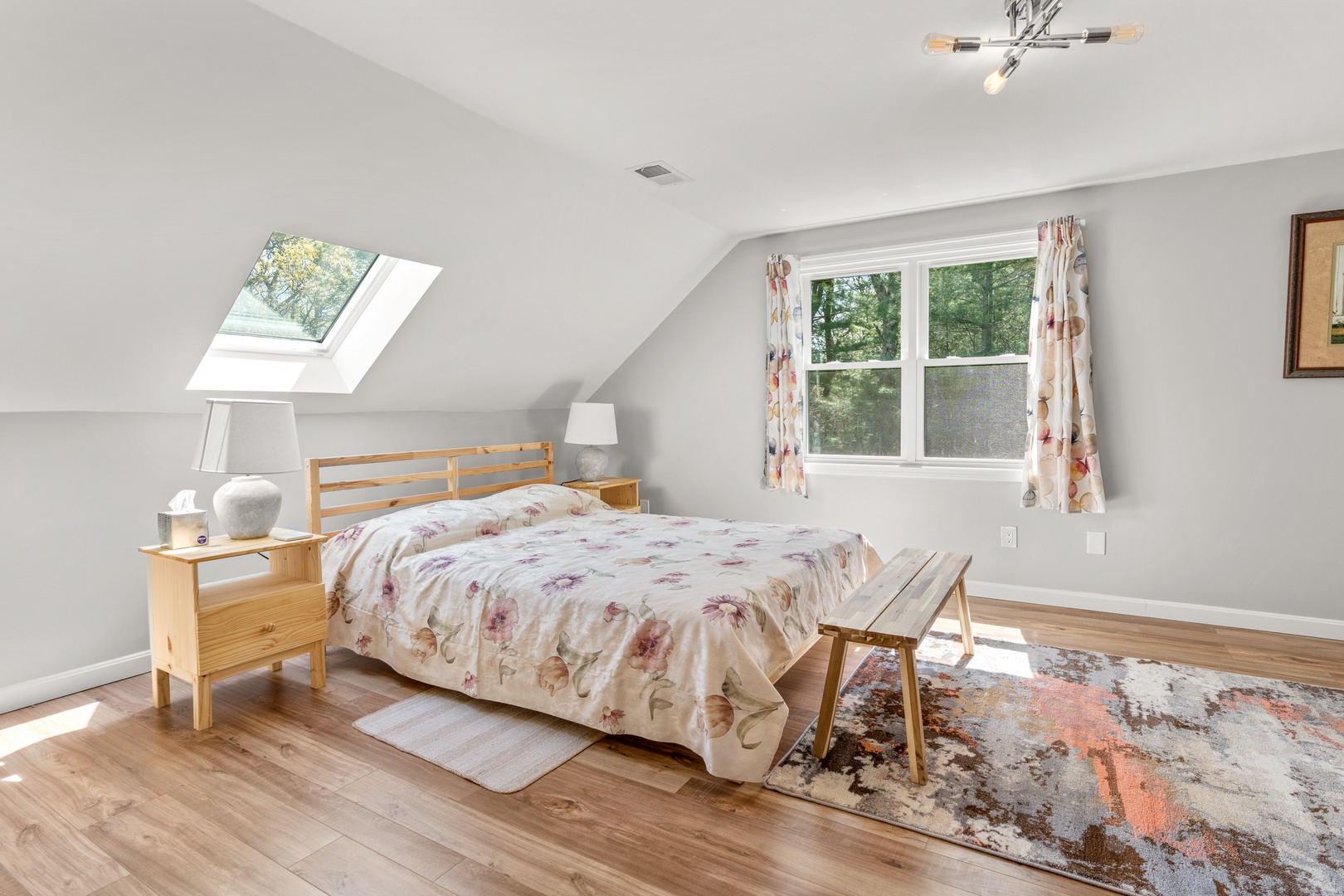 This bright, cheerful bedroom retreat offers a plush queen-sized bed