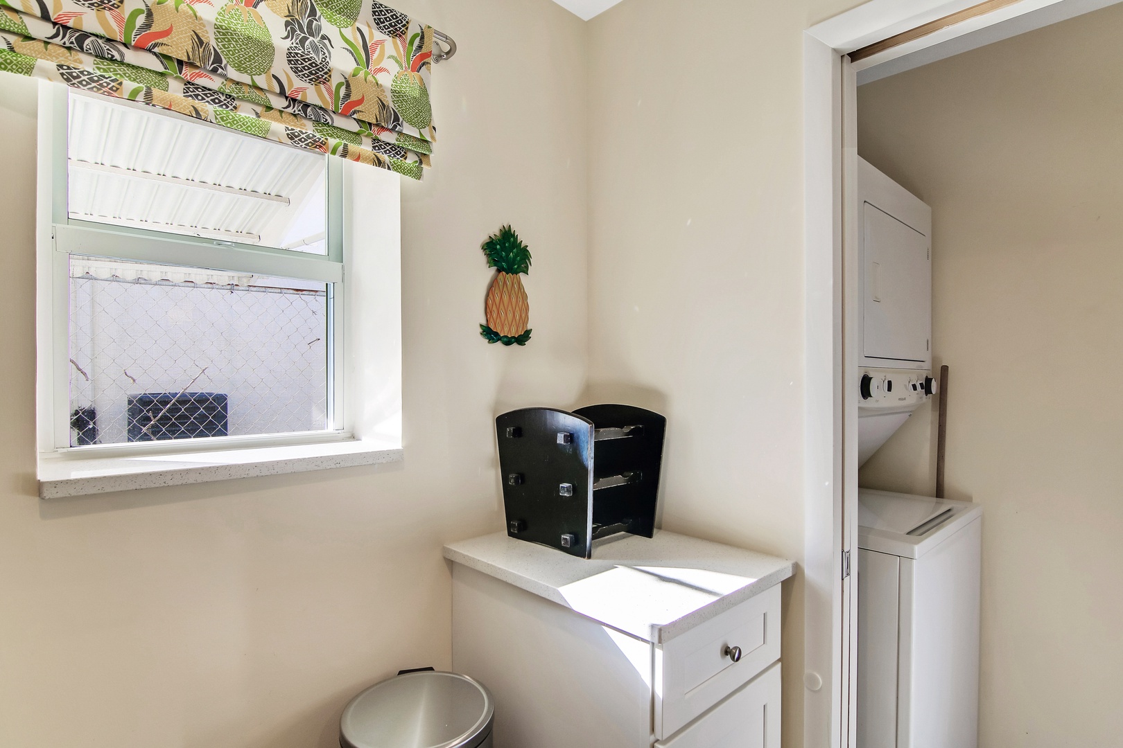 Private laundry is available for your stay, tucked away off the kitchen