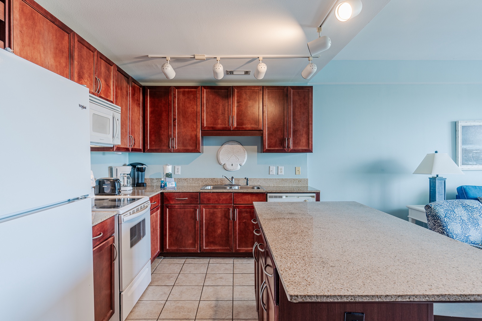 The spacious kitchen offers ample space & all the comforts of home