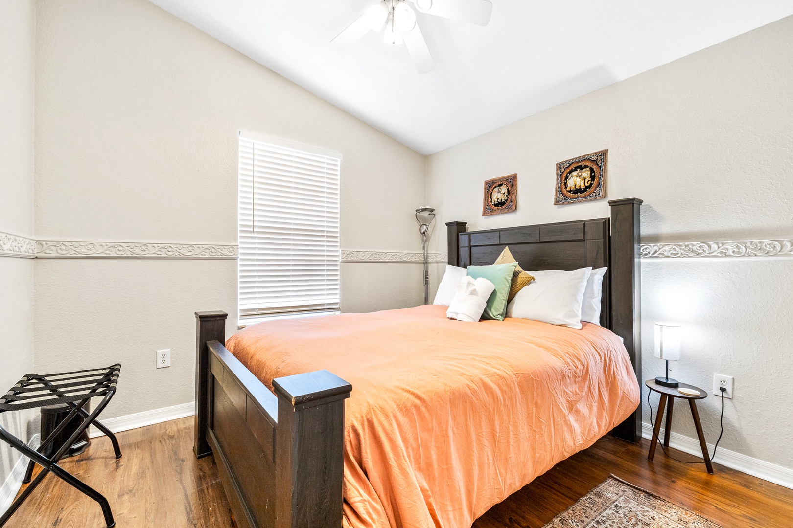 The 1st of 3 serene bedrooms, boasting a plush queen-sized bed