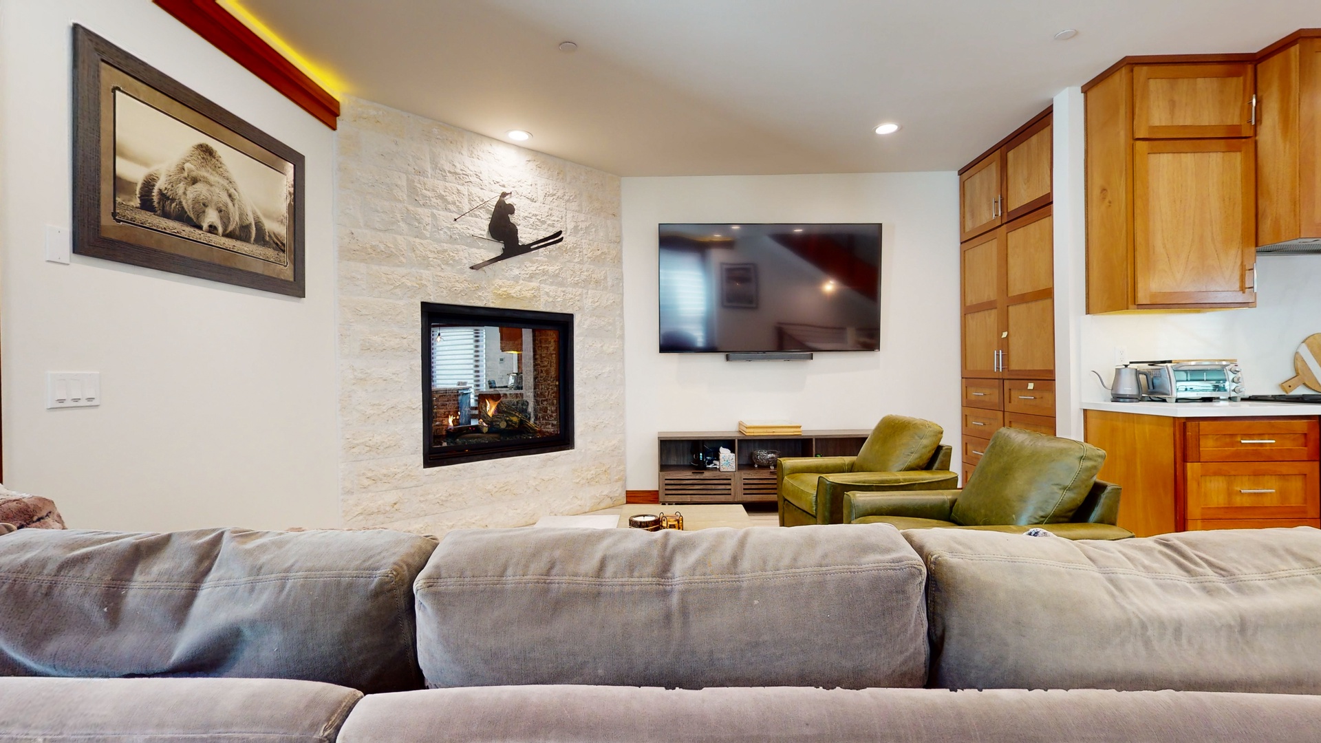 Curl up for a movie or enjoy a warming fire in the living room’s gas fireplace