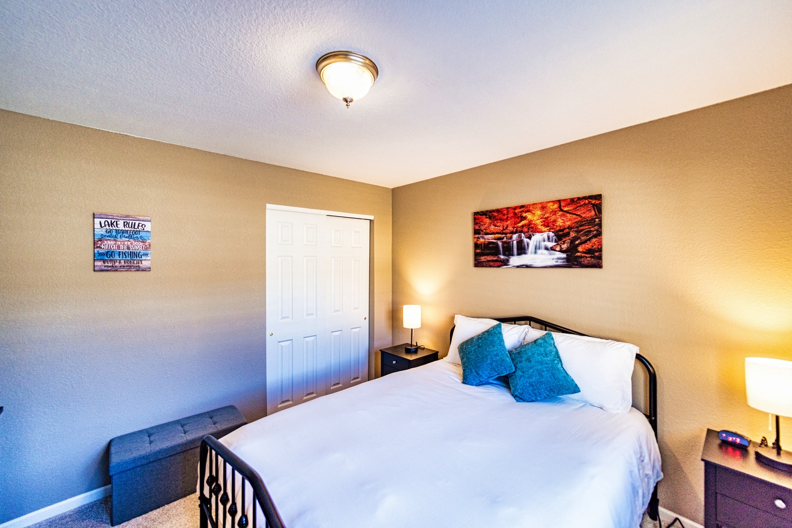 The second bedroom offers a queen bed, Smart TV, & Nintendo