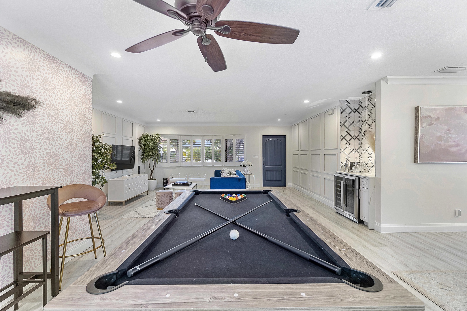 Game room with pool table and dry bar