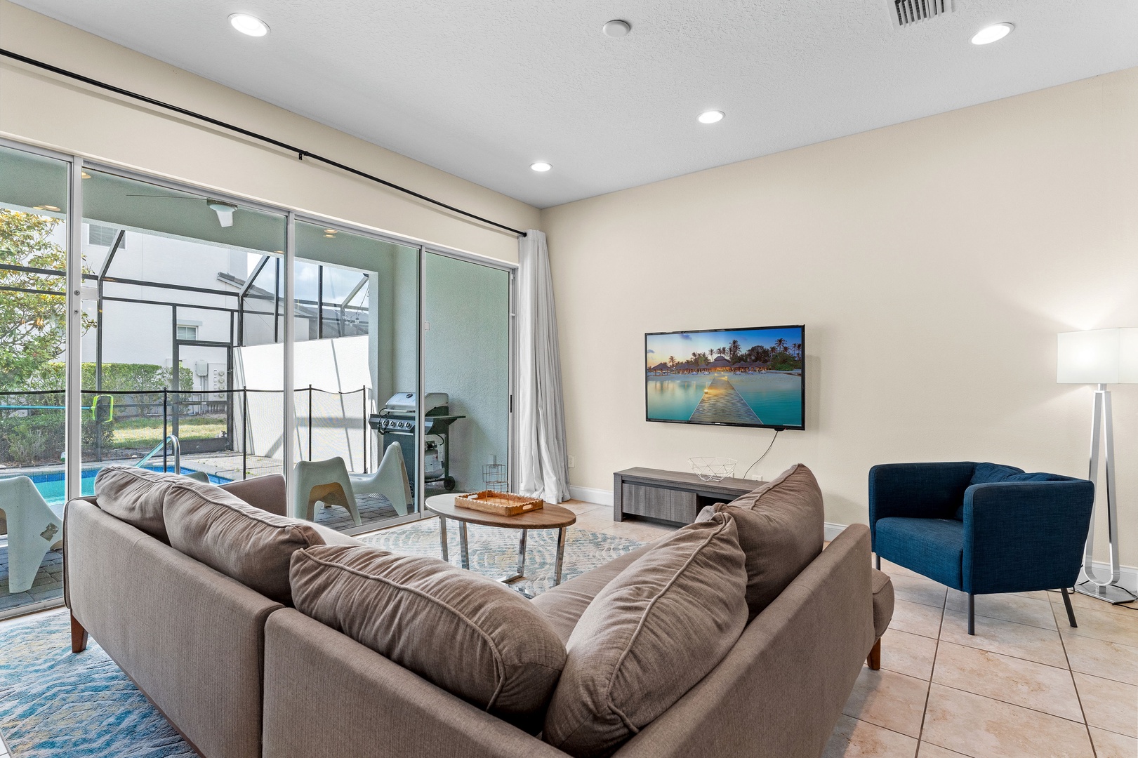 Living area with sectional seating and Smart TV