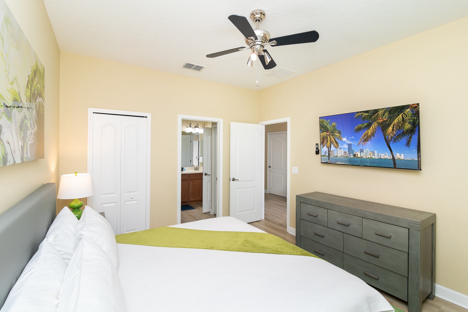 This colorful main-floor king suite boasts a smart TV and Jack & Jill ensuite